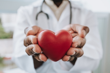 Physician holding a heart-shaped object to represent Heart Health Month. | ProFysio Physical Therapy