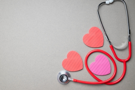 Stethoscope with paper hearts surrounding it for National Heart Month. | ProFysio Physical Therapy